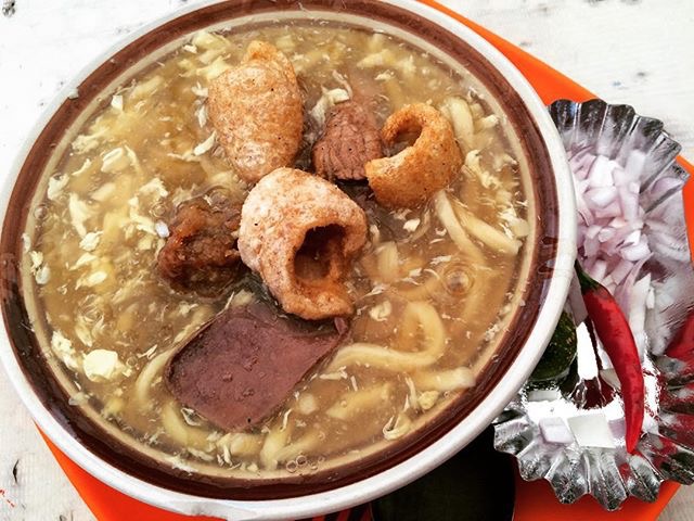 Lomi topped with chicharon