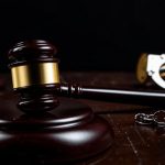 arrested in handcuffs, then being judged